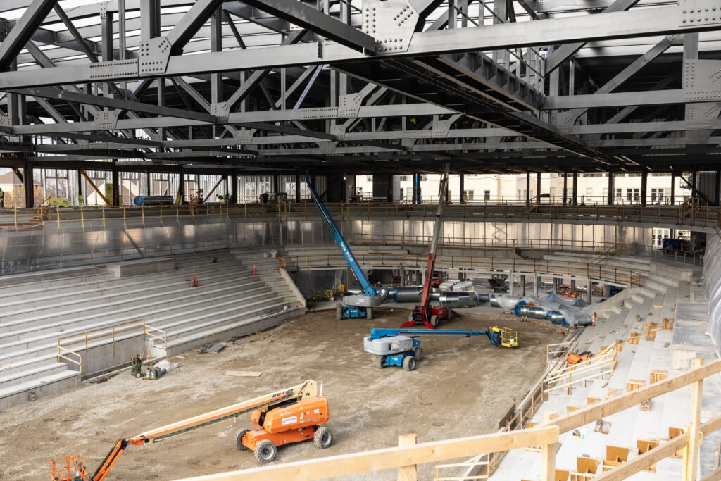 The bowl of the Lee and Penny Anderson Arena with seating for the primary rink and basketball arena.