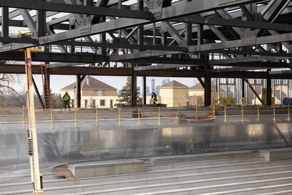 Crews work on the main arena area for hockey and basketball.