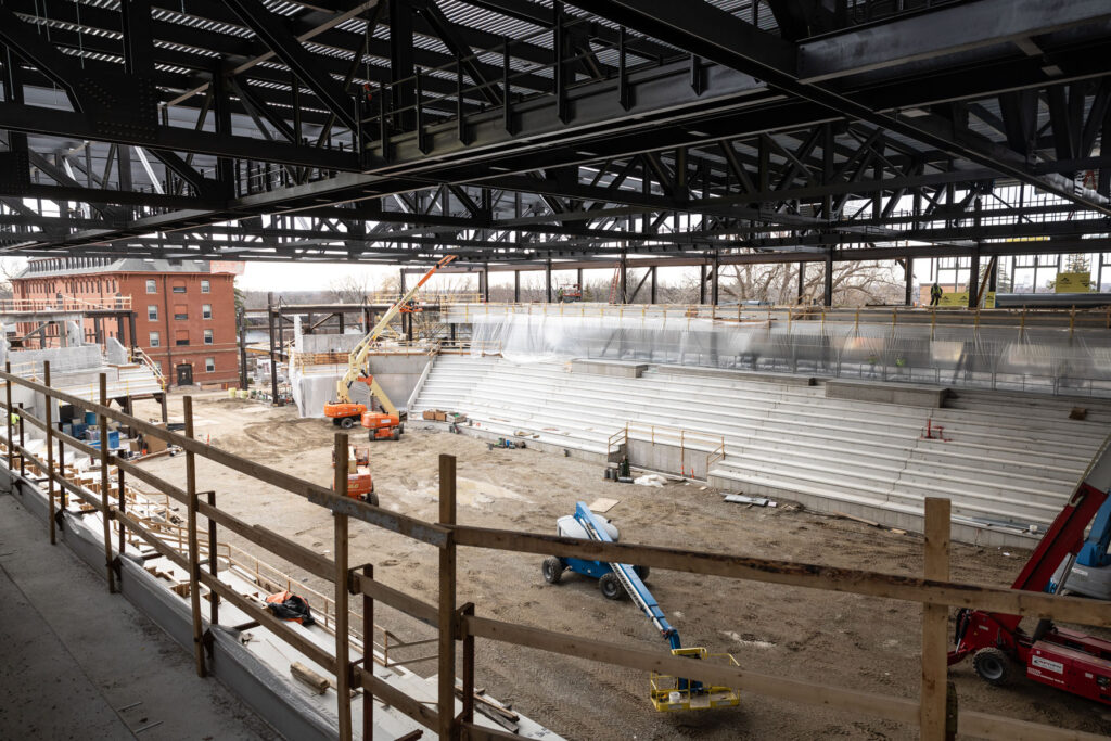 Crews work on the main arena area for hockey and basketball.