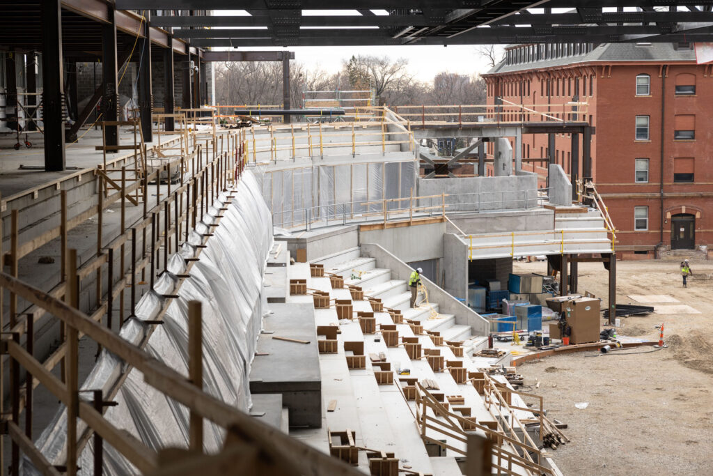 Crews work on the main arena area for hockey and basketball.