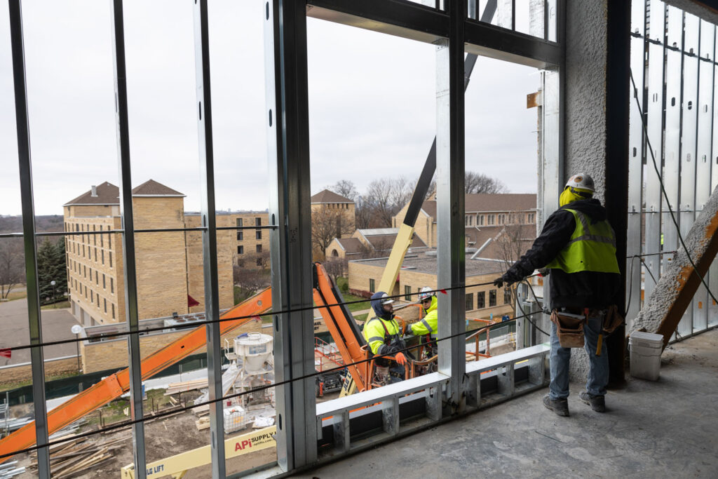 Crews work on the main arena area for hockey and basketball.