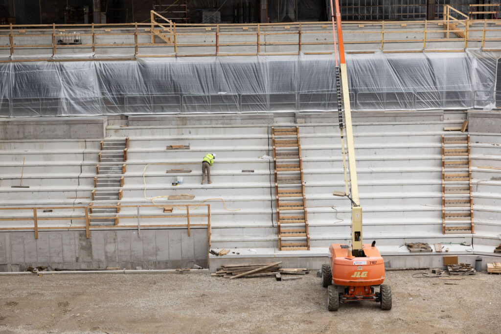 Crews work on the main arena area for hockey and basketball.