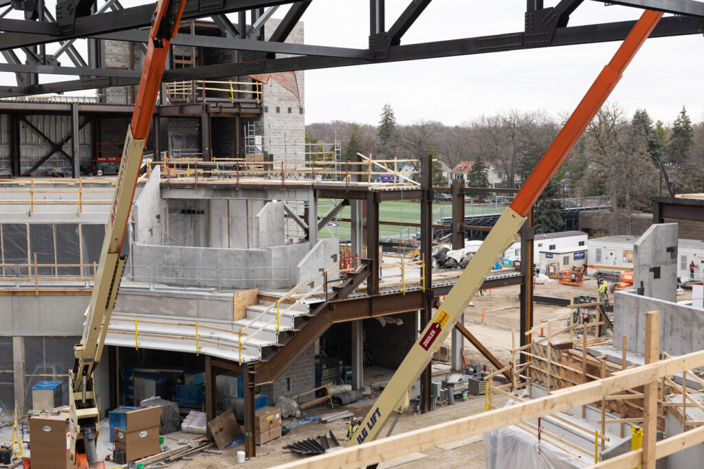 Crews work on the main arena area for hockey and basketball.