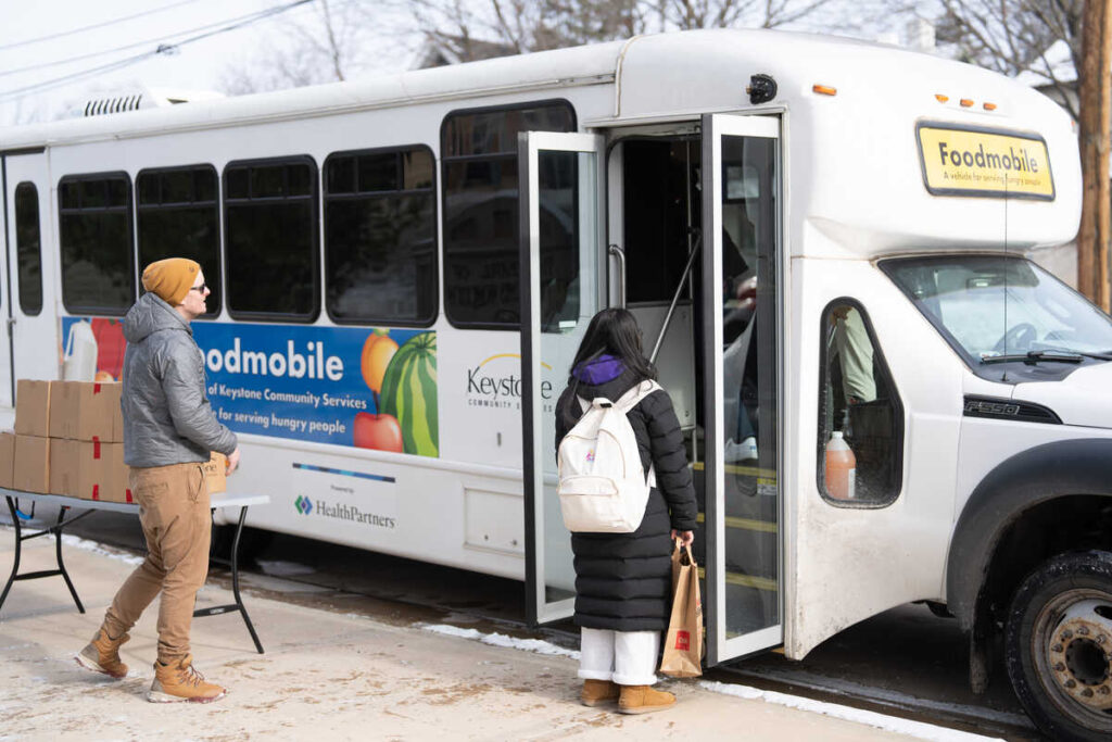 Visitors to Tommie Shelf Foodmobile.