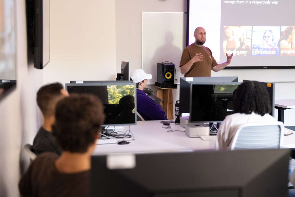 Professor Sky Anderson teaches a video game course in Schoenecker Center.