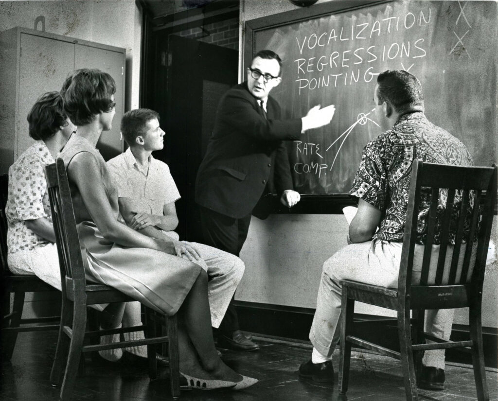 Man teaching a class. Black and white. 