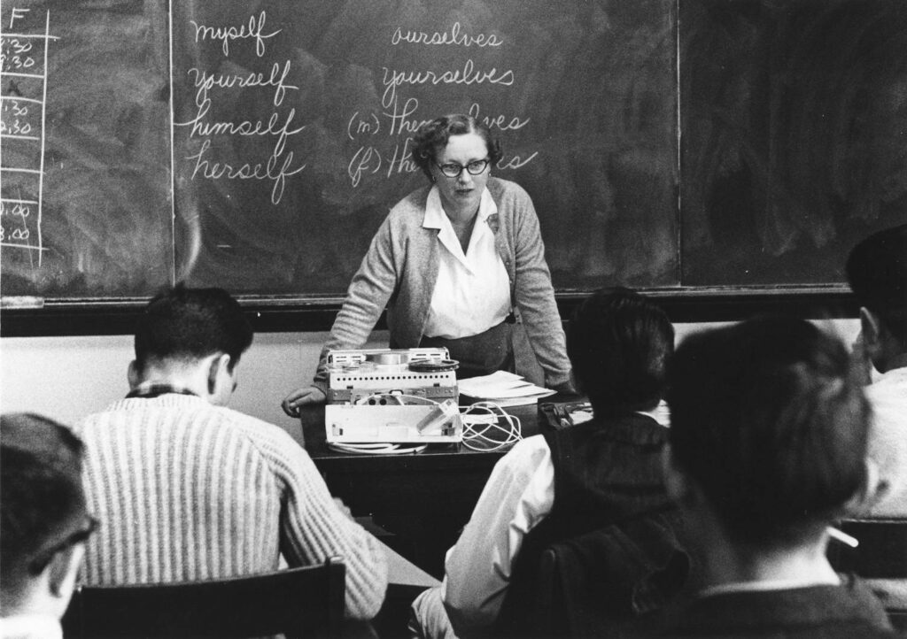 Woman teaching a class. Black and white. 