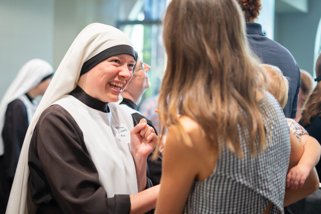 A woman talking with a sister. 