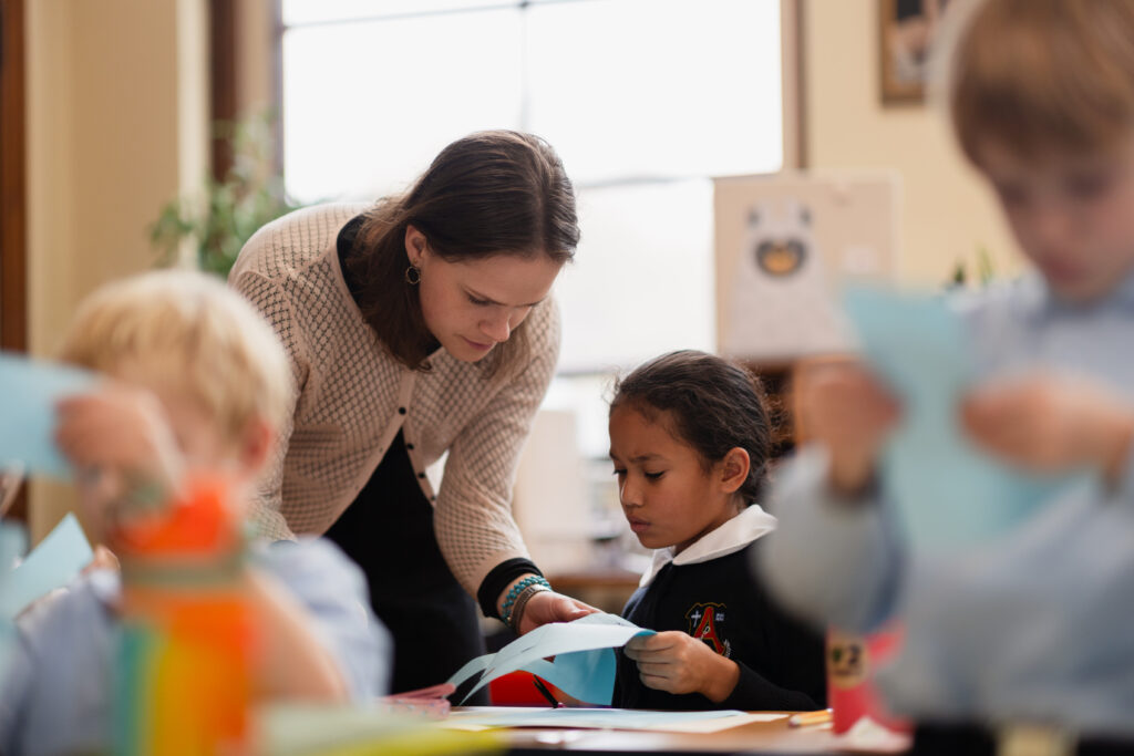 Woman helping a child