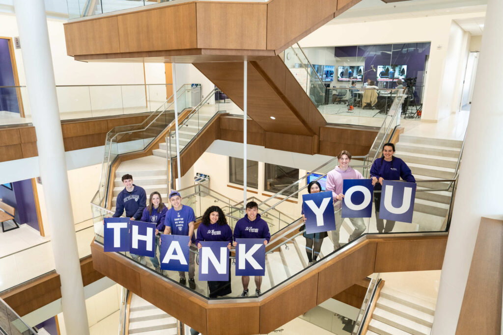 Schoenecker Center students hold thank you letters