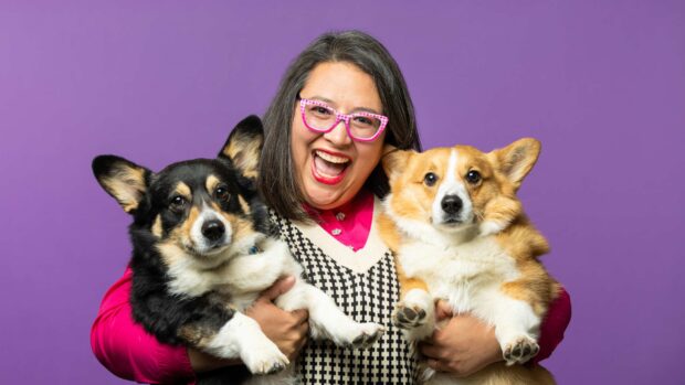 Manuela Hill-Mu�oz holds her two corgis.