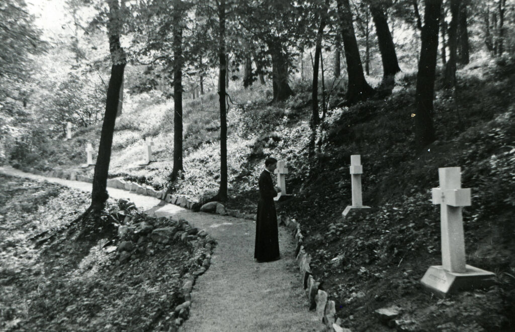 Seminarian Robert Probst praying along the Stations of the Cross in the Grotto, ca. 1943.