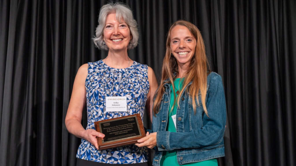 Erika Scheurer receiving award