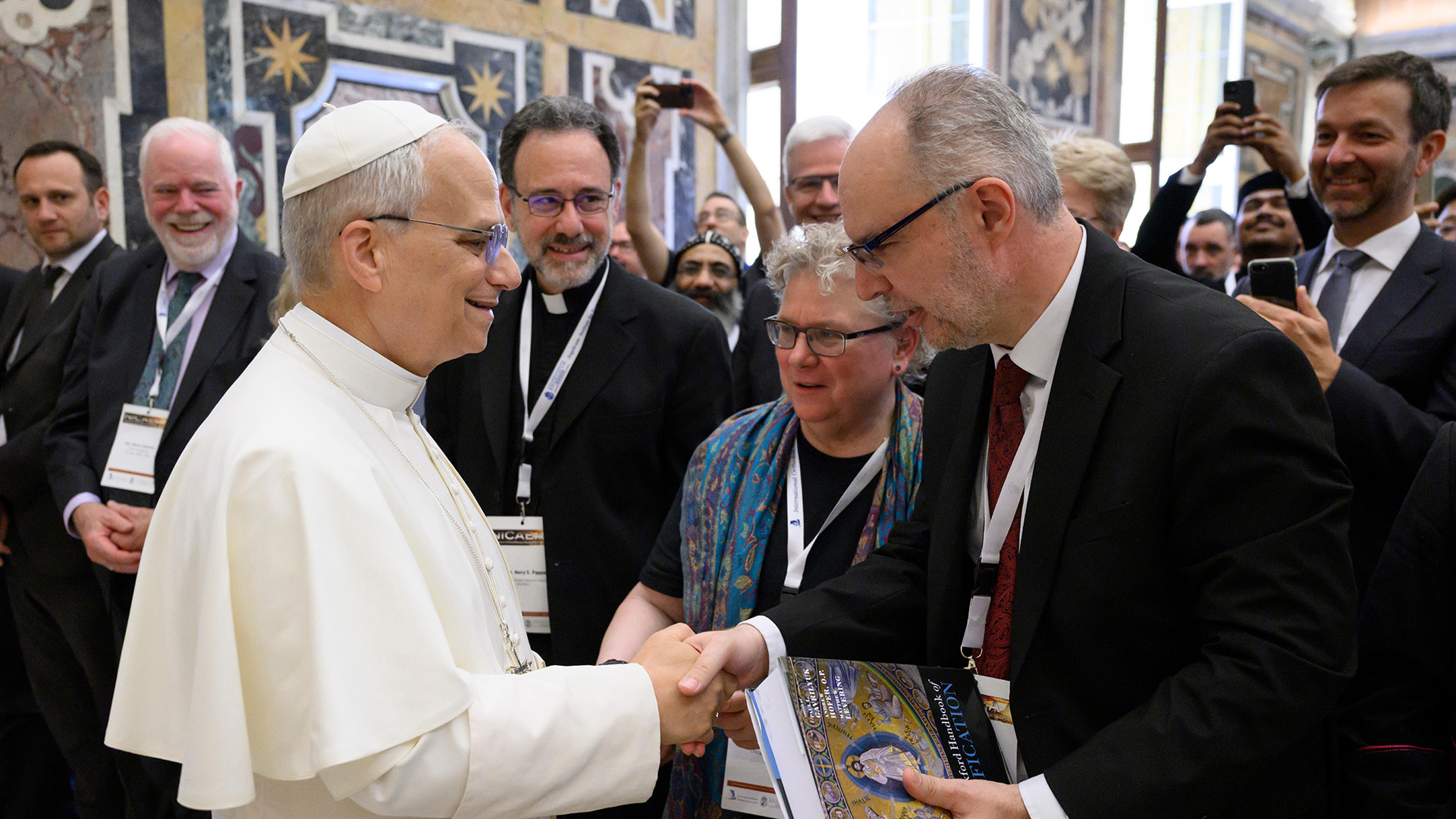 Pope Leo XIV shakes hands with Dr. Paul Gavrilyuk