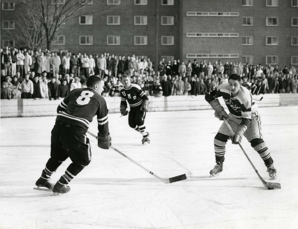 Men's hockey on outdoor rink behind Dowling Hall in 1960.