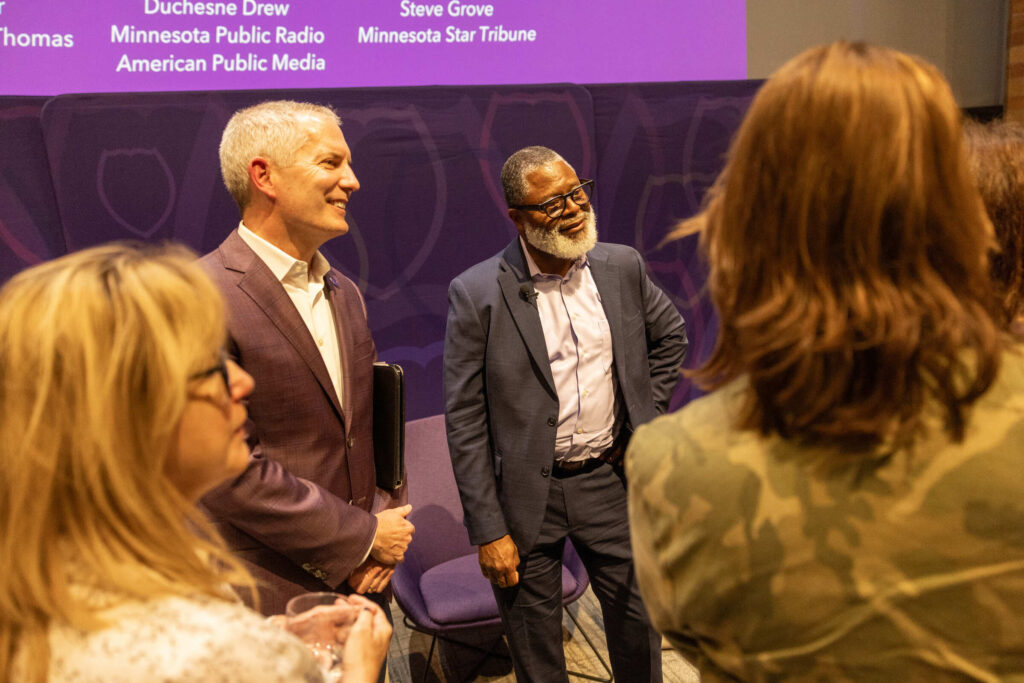 Duchesne Drew of Minnesota Public Radio and University of St. Thomas President Rob Vischer.