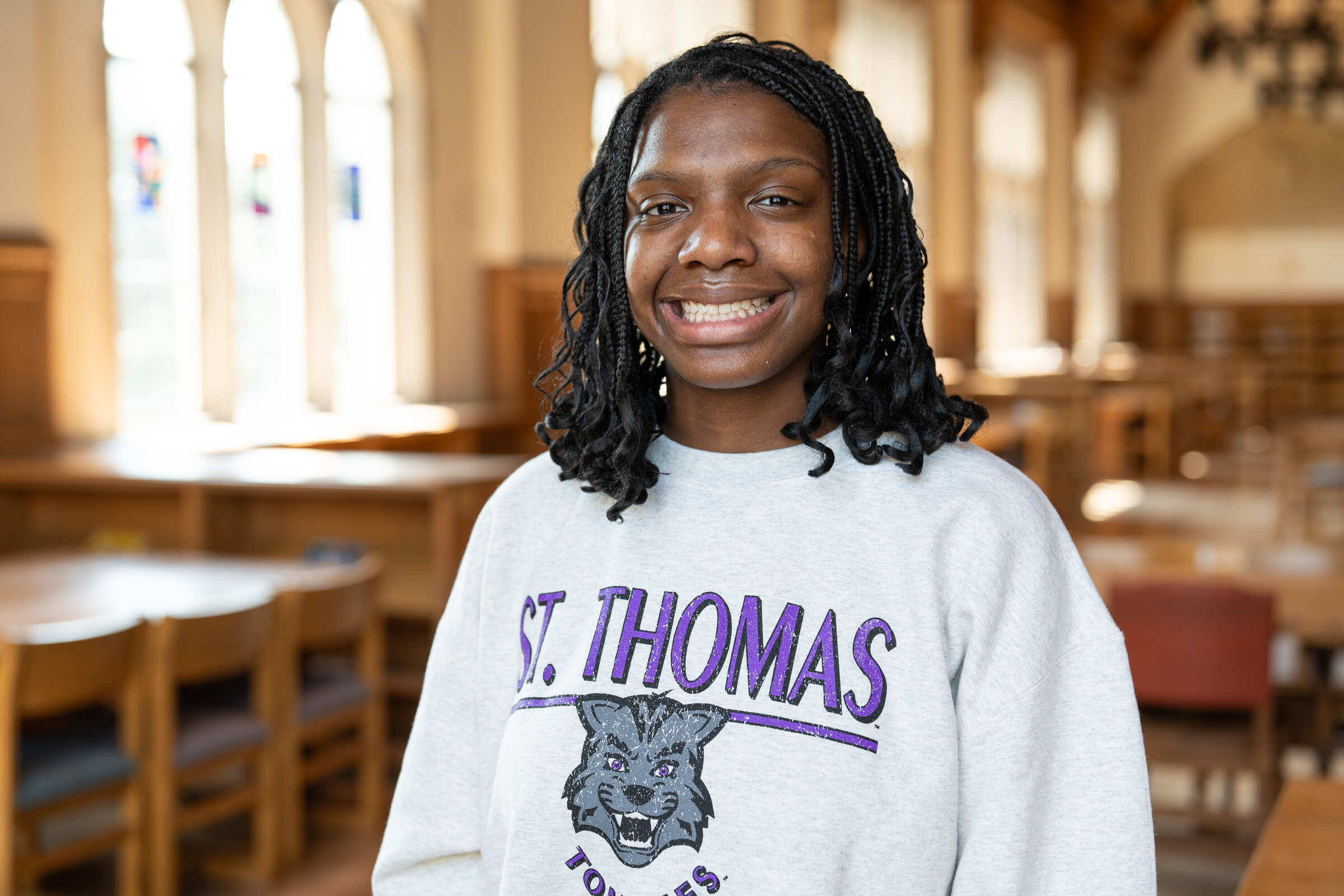 Junior Ariah Crosby smiling at camera in headshot