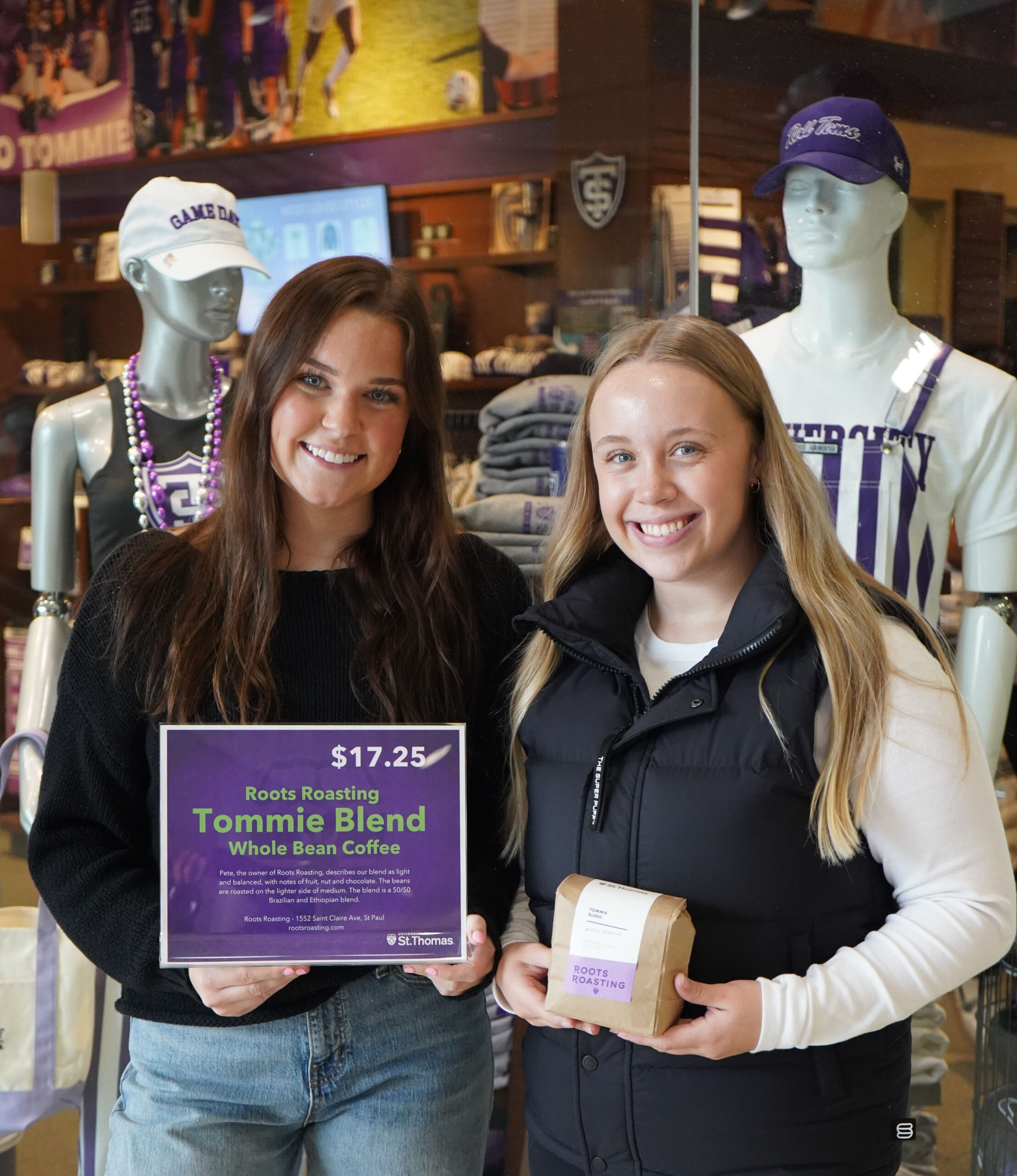 Brenna Keil and Clara Mattson smile for a photo holding Tommie Blend items.