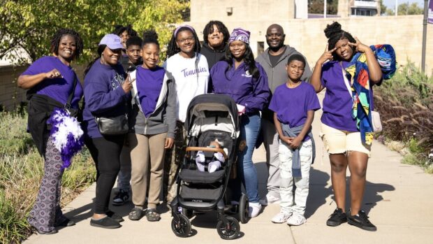 A family of 12 take a candid family portrait on St. Thomas plaza.