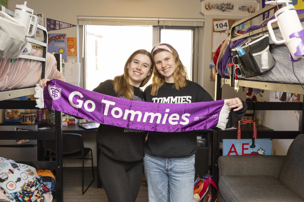 Students hold banner in Frey Residence Hall