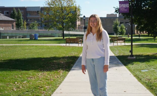 Katie Iverson standing on campus