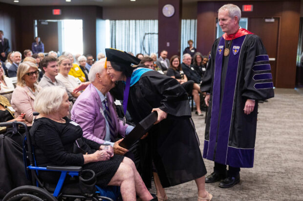 Dean MayKao Hang greets John Morrison