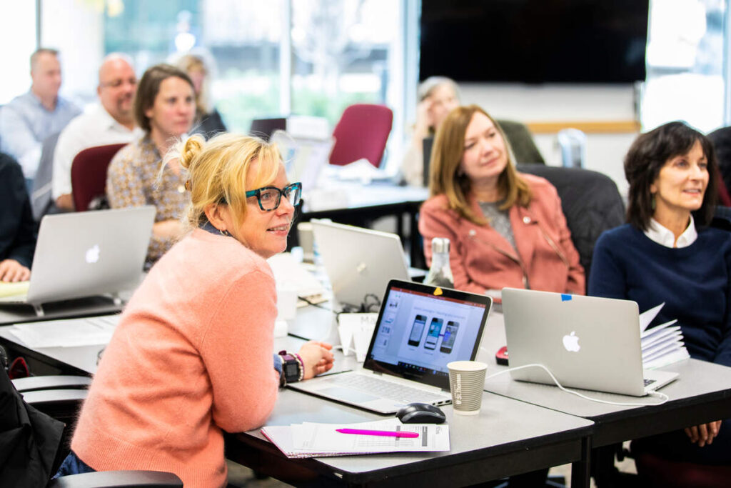 St. Thomas students at a table.