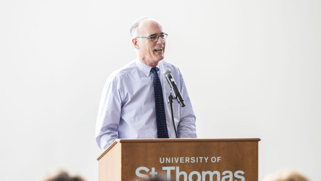 Professor of Theology Bernard Brady speaks during a faculty and staff gathering.