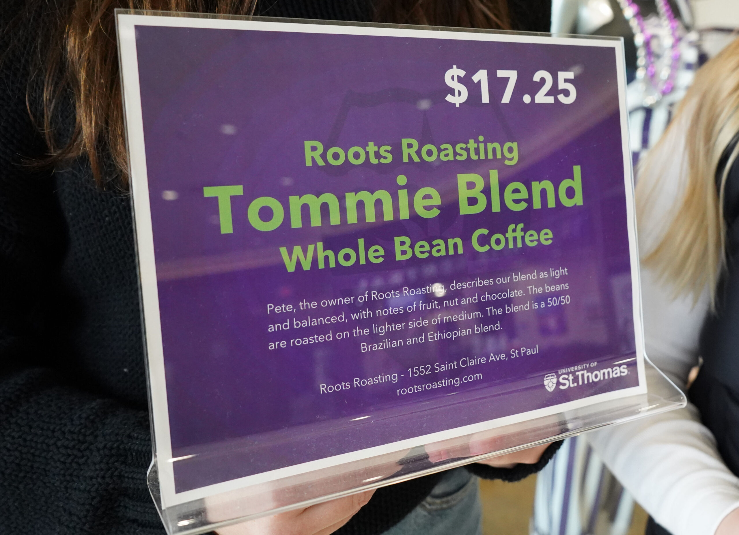 A sign for the Roots Roasting Tommie Blend whole bean coffee.
