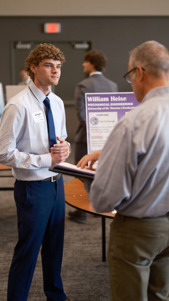William Heise meets with recruiter at fair