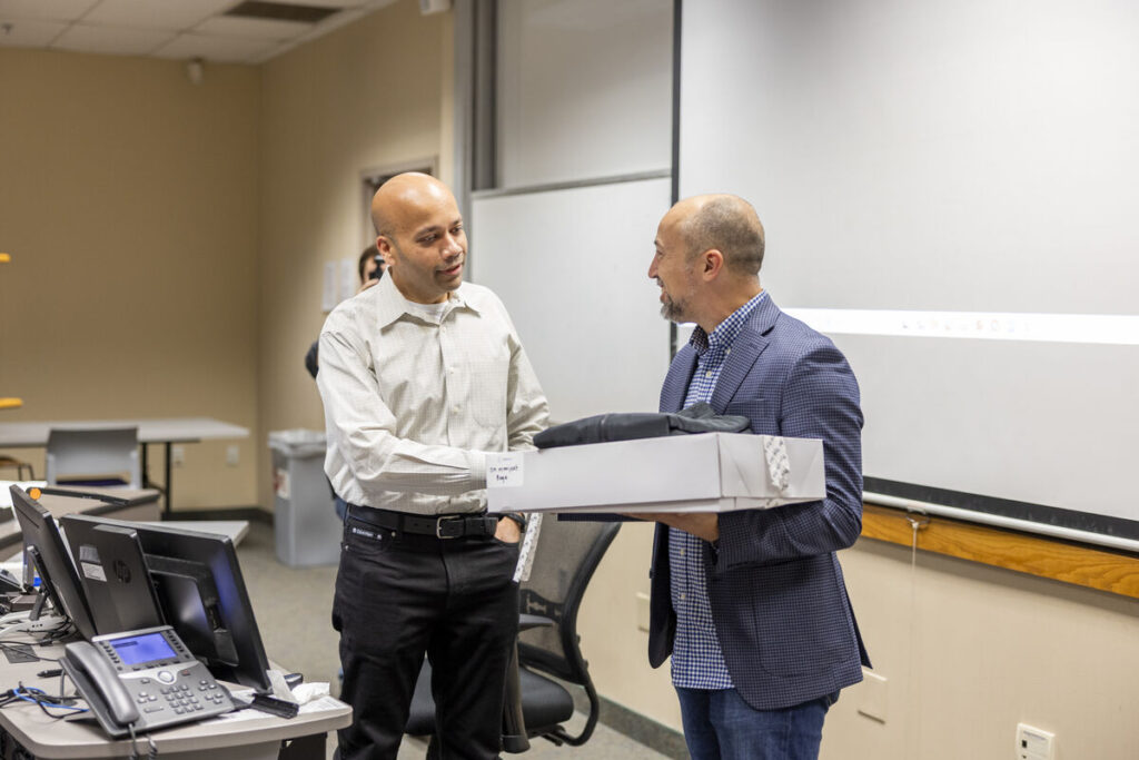 Dr. Manjeet Rege receives a surprise award from MnTech during his class