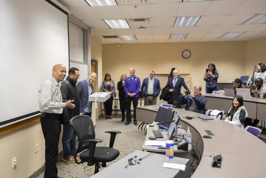 Dr. Manjeet Rege receives a surprise award from MnTech during his class