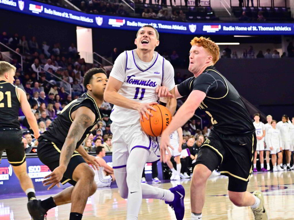 Austin Herro drives the lane in between two defenders