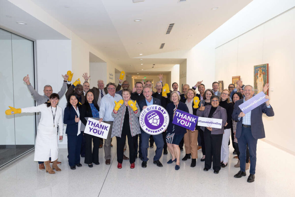 St. Thomas Leadership Team smiles for group photo.