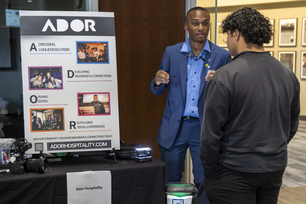 Marquan Harper presents at a competition.