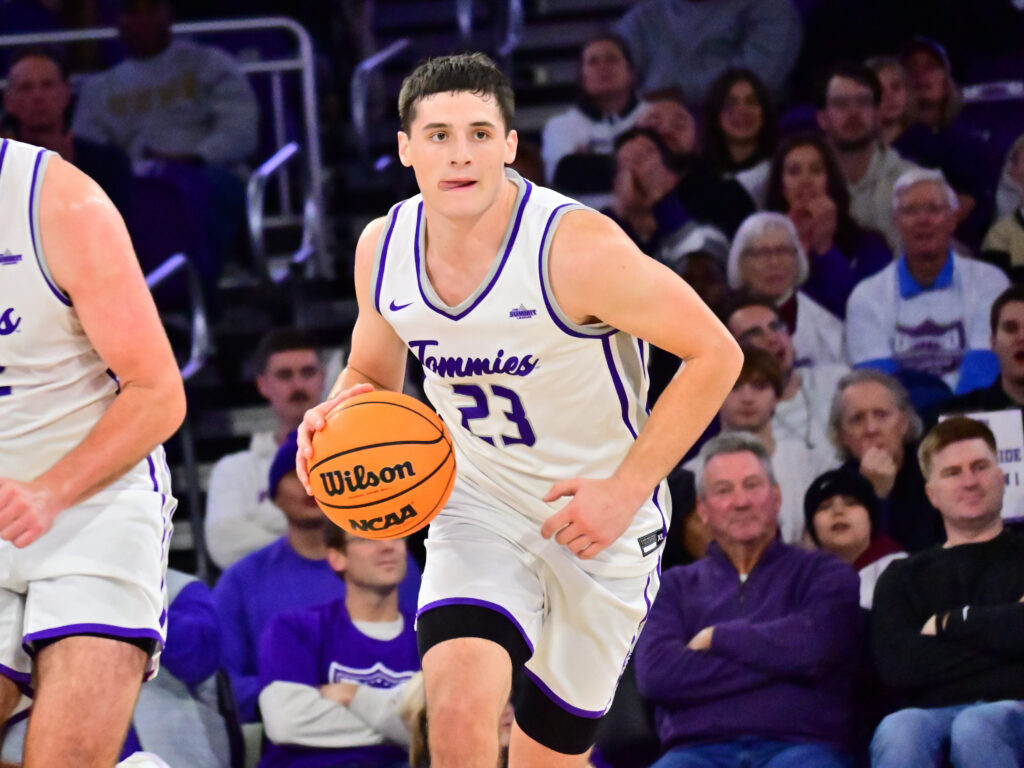 Nick Janowski dribbles the ball up court