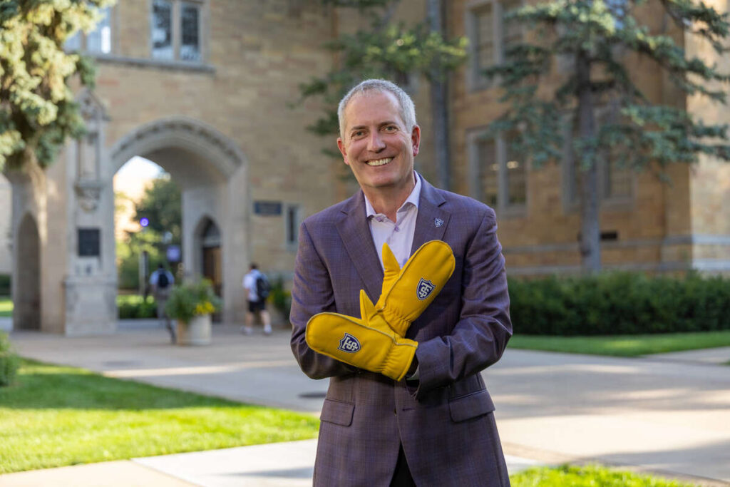 President Robert Vischer sports yellow chopper gloves
