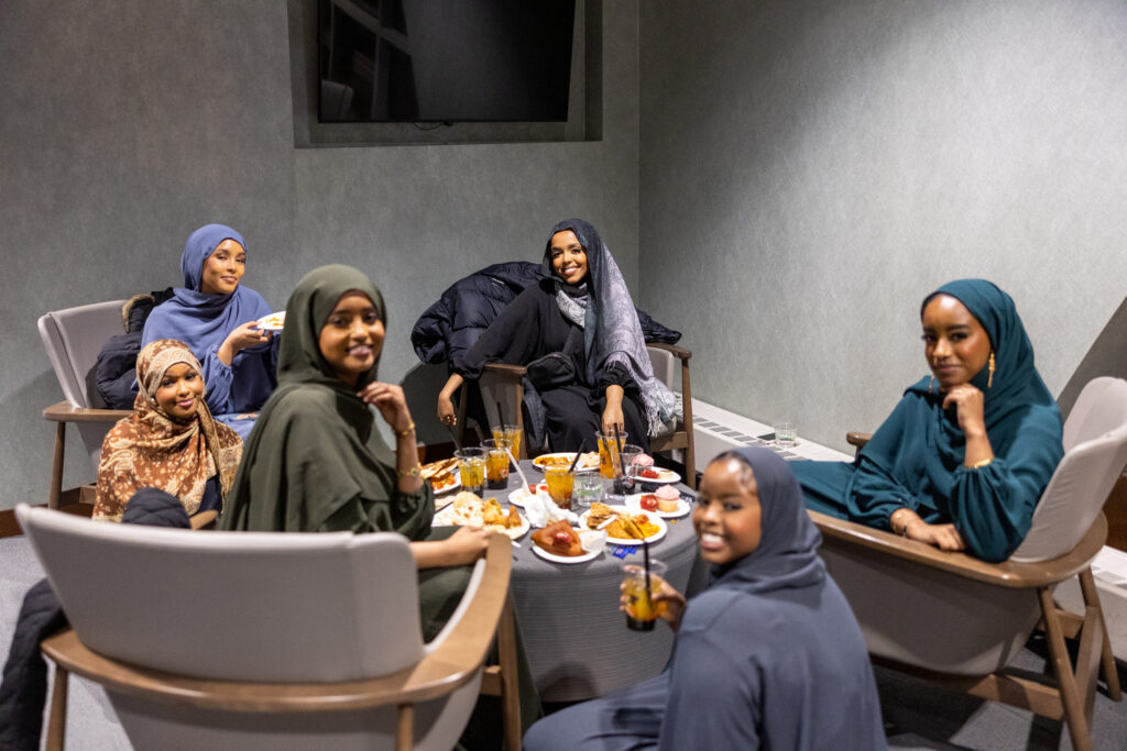 Six Muslim students share a meal at a special Muslim Student Association Dinner.
