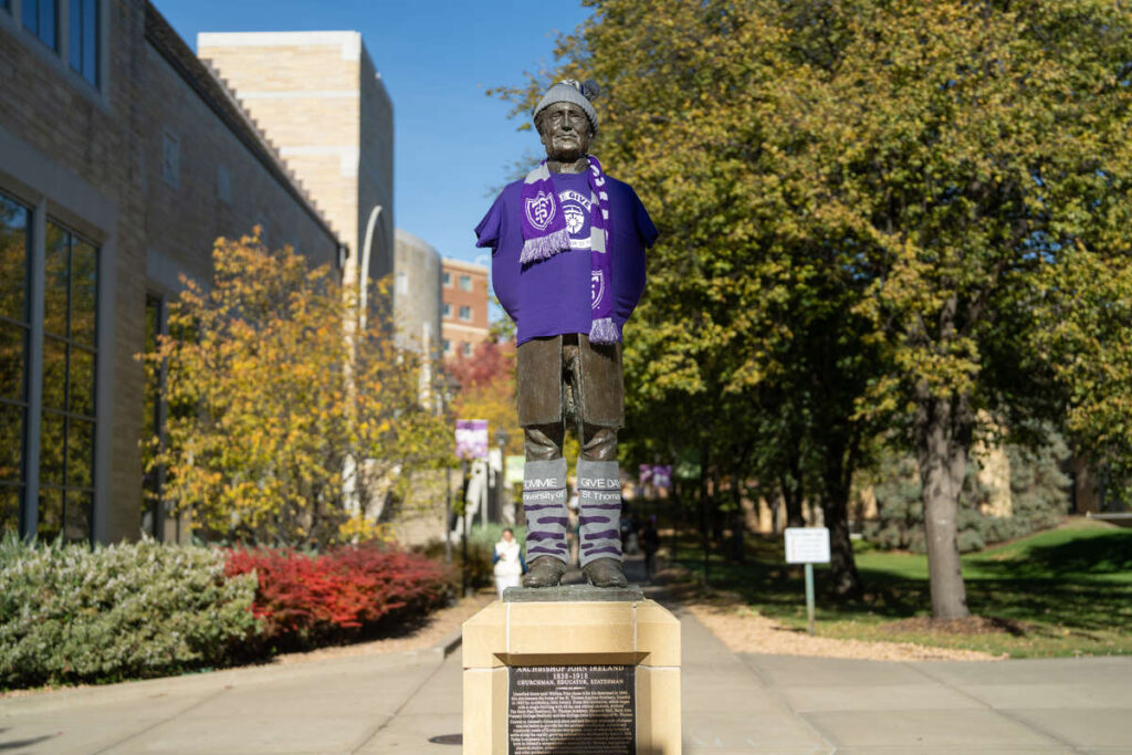 The statue of Archbishop John Ireland dressed in Tommie gear
