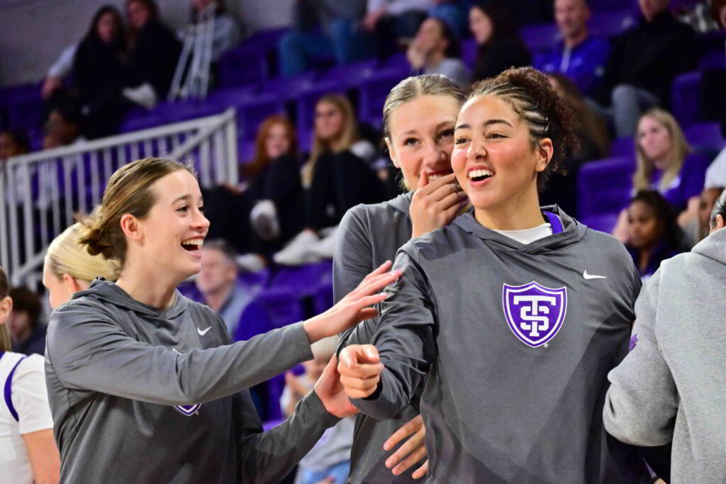 Three Tommies on the sideline laughing