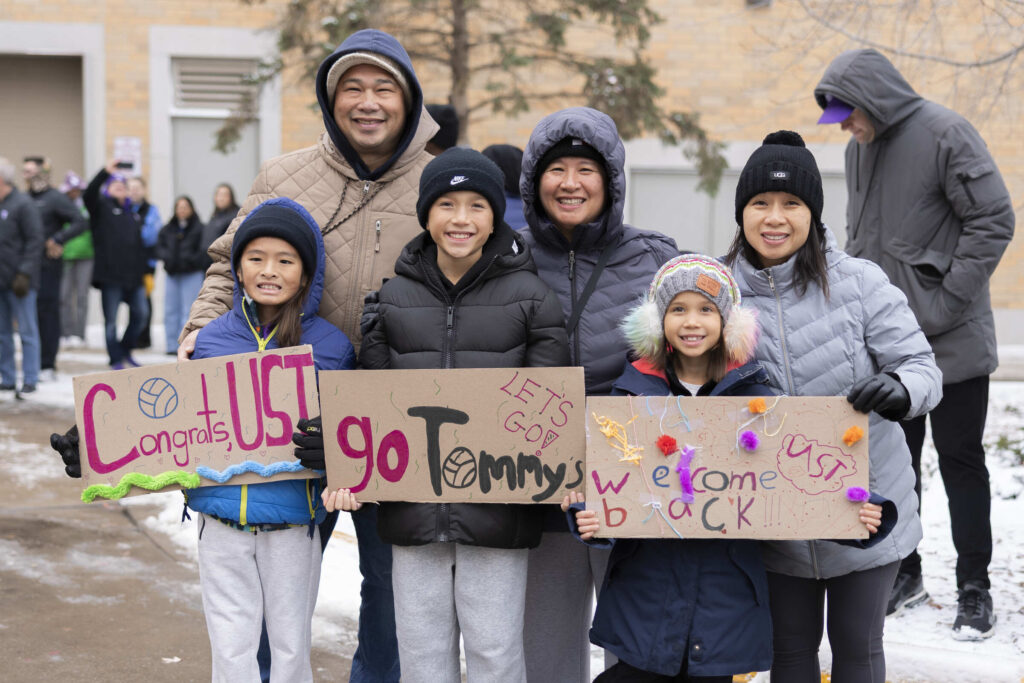 Fans holding signs