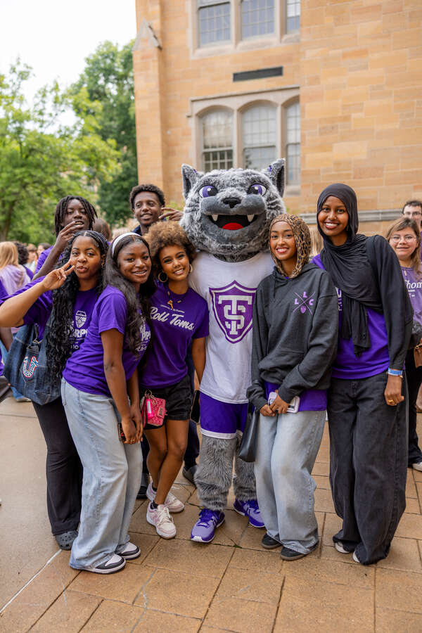Students pose for a photo with Tommie as they March Through The Arches on September 02, 2025 in St. Paul.