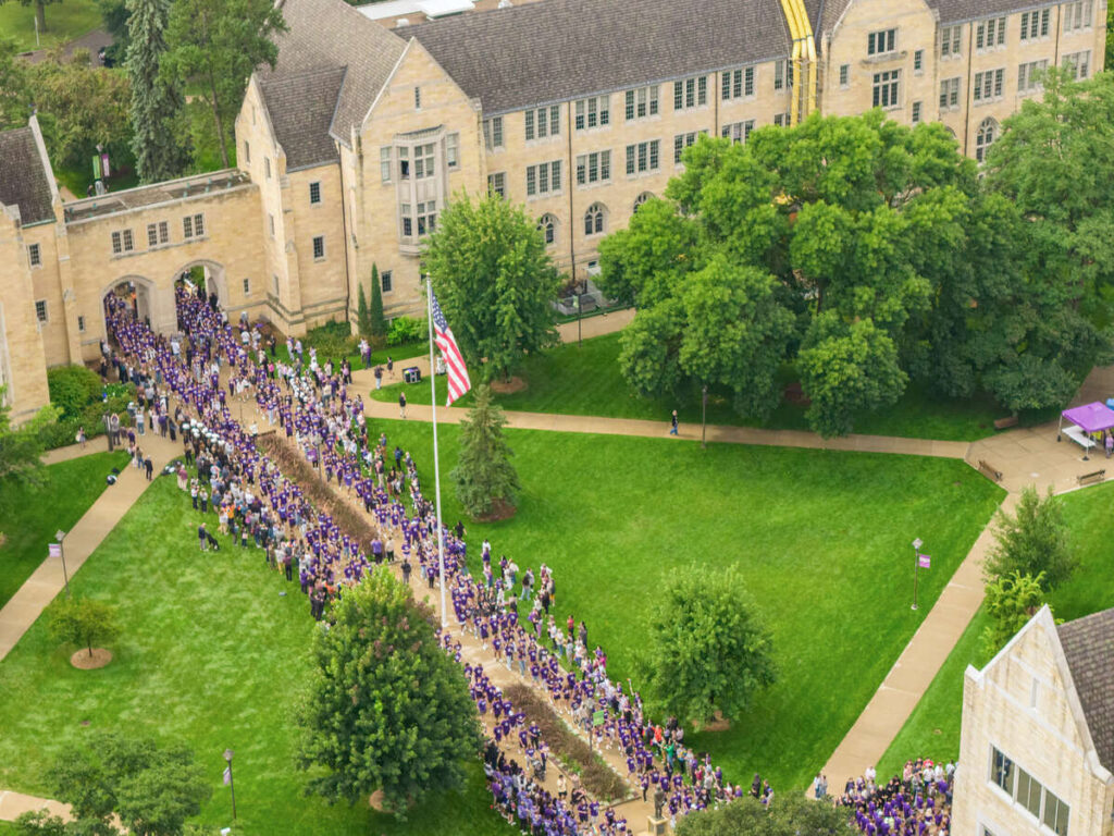 Incoming students gather for the annual March Through the Arches event on the St. Paul campus on September 2, 2025.