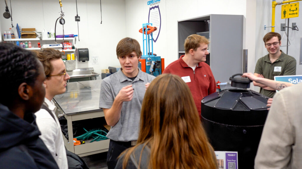 A team presenting their project at a senior design clinic