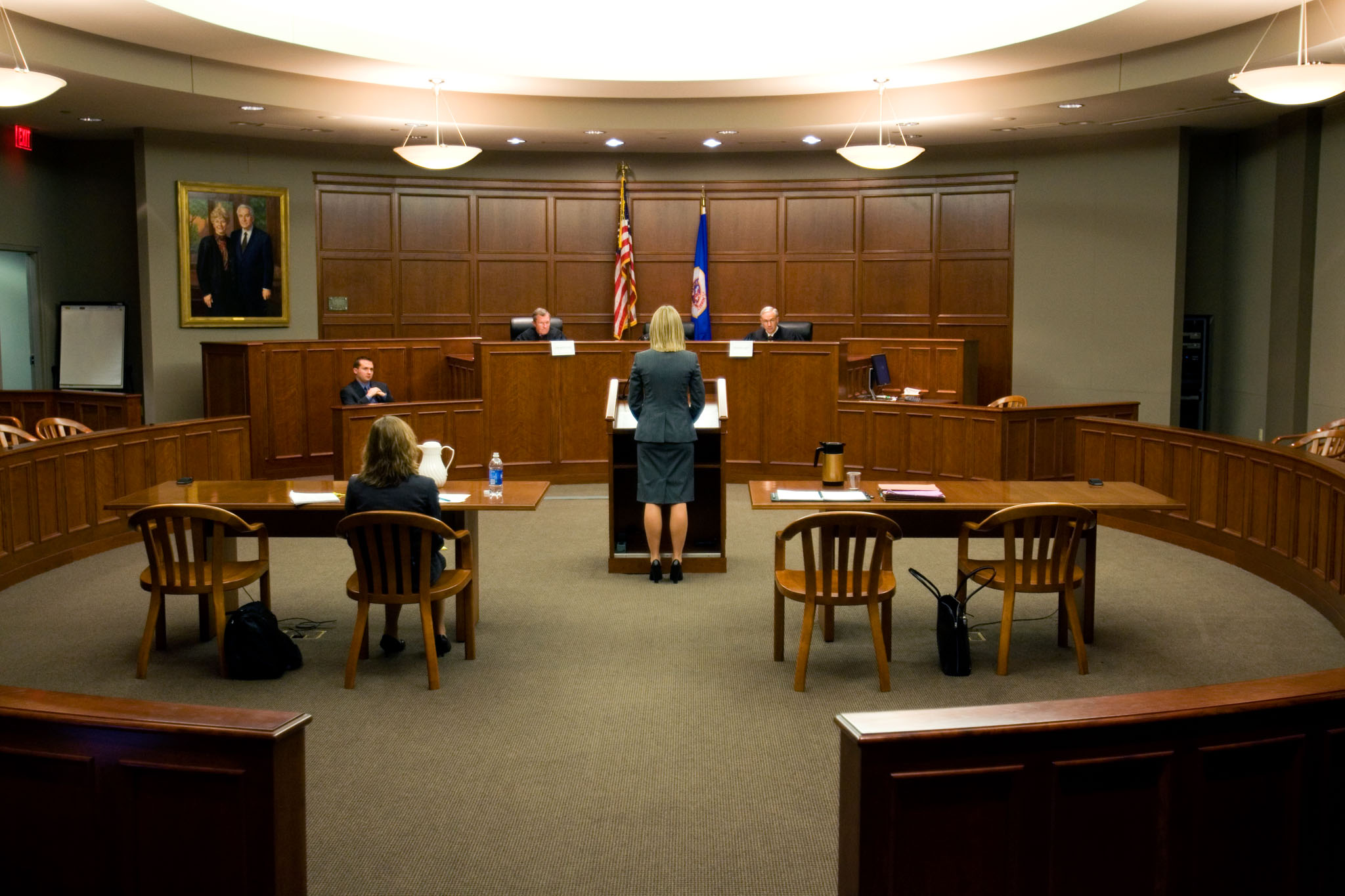 A School of Law student (back to camera) addresses the bench in the Frey Moot Courtroom.