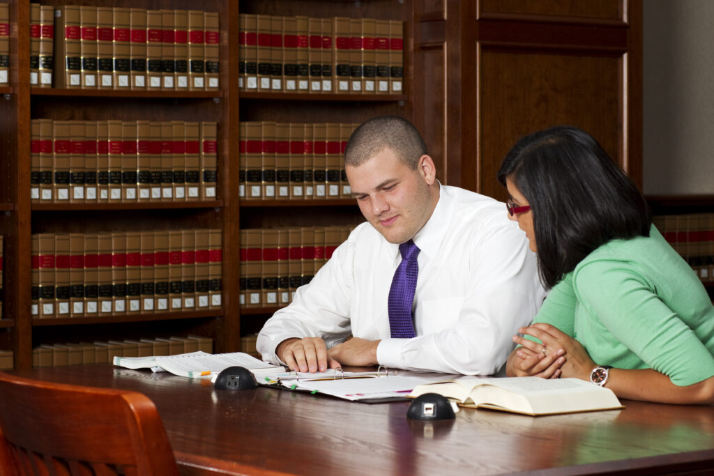 School of Law students reading papers together