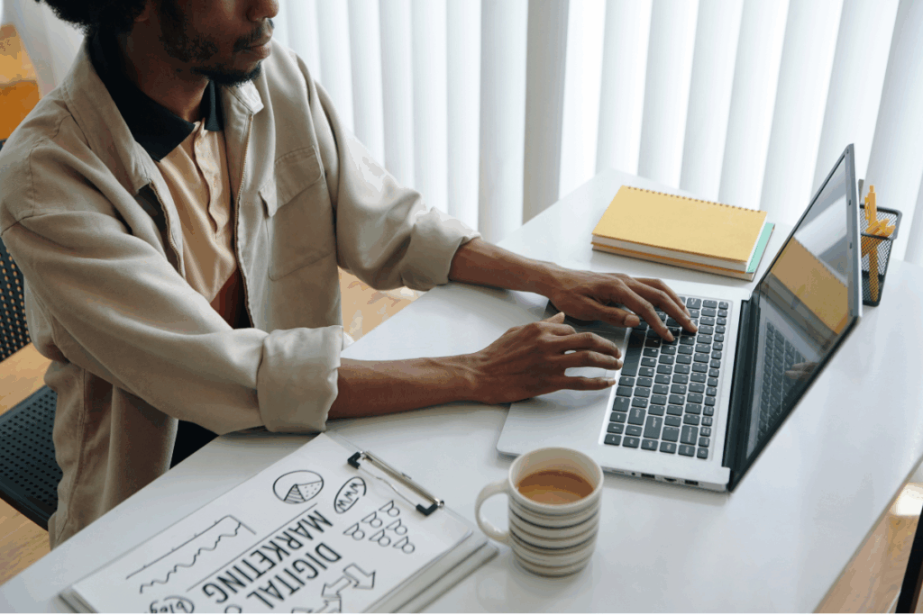Woman sitting in front of a computer while working.