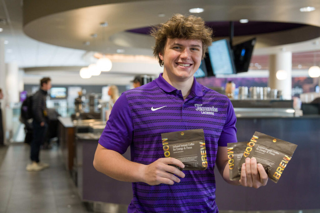 Mood Brew George Dannecker holding coffee packets