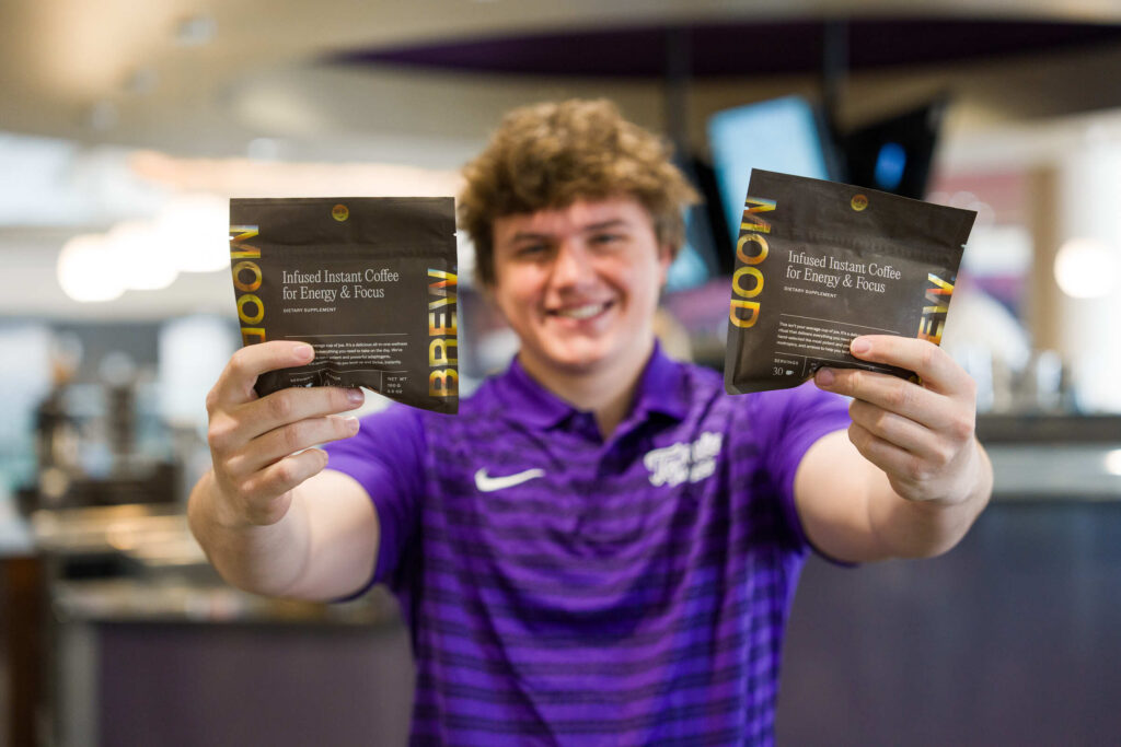 Mood Brew George Dannecker holding coffee packets
