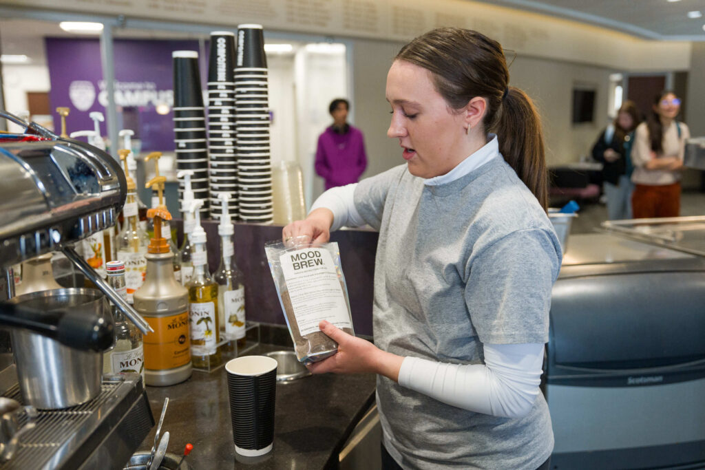 Student Matilda Lange makes espresso